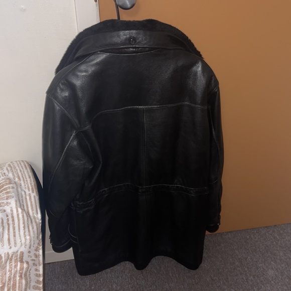 This is a huge leather jacket with fur lining at neck. - Picture 2 of 5